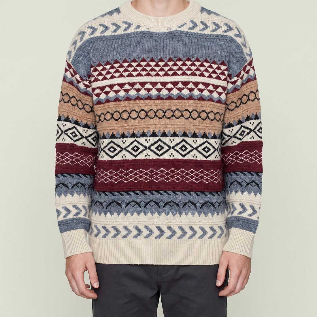 Man wearing Bear's fair isle jacquard knit sweater from Obsession, cropped below the chin, red colorway
