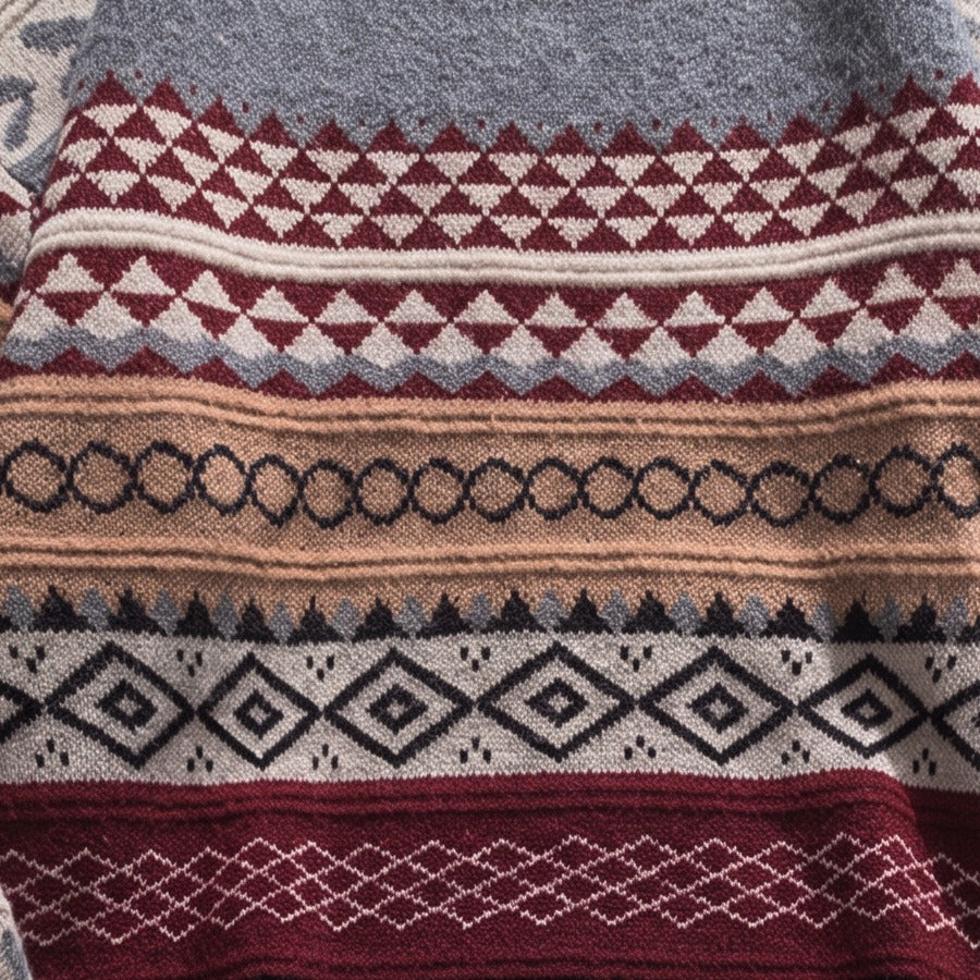 Close-up detail of the fair isle jacquard knit pattern on Bear's sweater