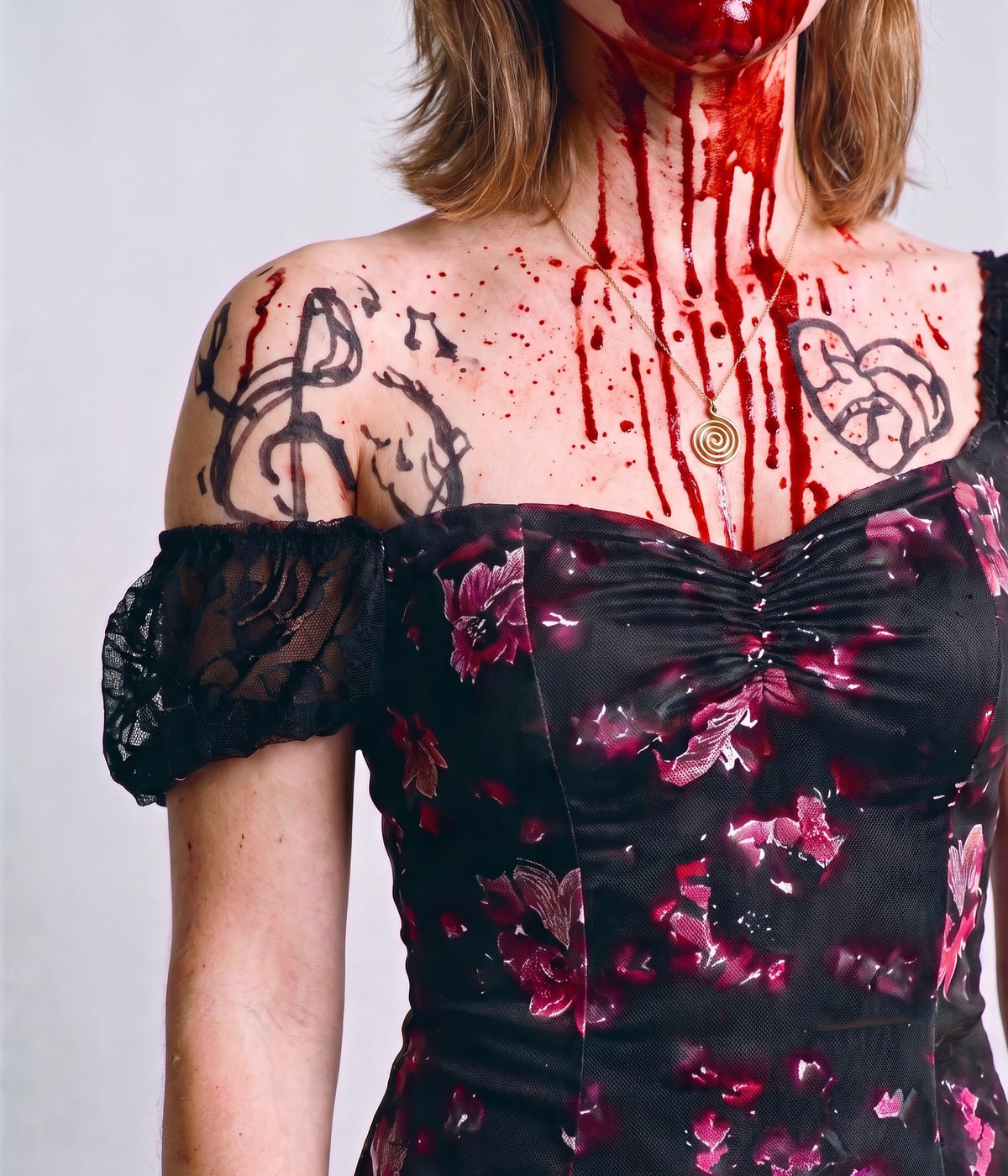 Close-up of the floral mini dress neckline with a lace puff sleeve, black marker tattoos and fake blood makeup on the chest